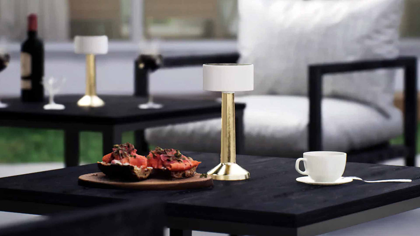 Halo | Cordless Table Lamp | Iron, Acrylic | Gold color of product | Light off | Mid-range distance to lamp | At backyard patio | Noon