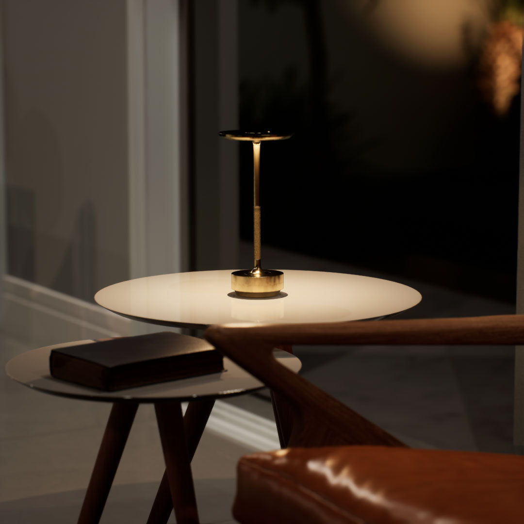 Amberly | Cordless Table Lamp | Aluminum | Gold color of product | Warm light on | Mid-range distance to lamp | At coffee table | Evening | scene 1