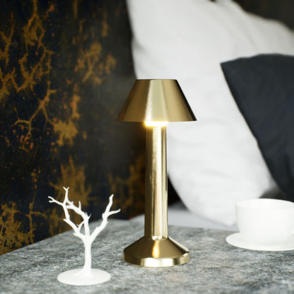 Bella | Cordless Table Lamp | Iron, Acrylic | Gold color of product | Light off | Close-up distance to lamp | At bedside table | Modern interior | Noon