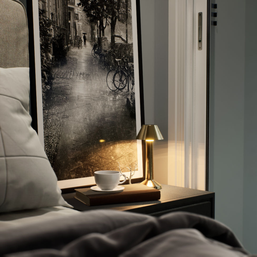 Bella | Cordless Table Lamp | Iron, Acrylic | Gold color of product | Warm light on | Mid-range distance to lamp | At bedside table | American classic bedroom | Evening  | Scene 2
