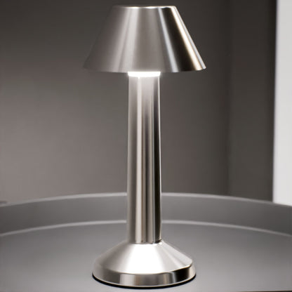 Bella | Cordless Table Lamp | Iron, Acrylic | Silver color of product | Warm light on | Mid-range distance to lamp | At coffee table | Modern interior | Evening | Scene 4