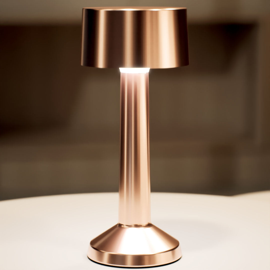 Copri | Cordless Table Lamp | Iron, Acrylic | Bronze color of product | White light on | Close-up distance to lamp | At coffee table | Modern interior | Evening | Scene 4