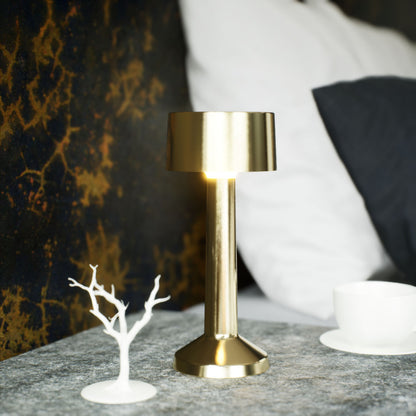 Copri | Cordless Table Lamp | Iron, Acrylic | Gold color of product | Light off | Close-up distance to lamp | At bedside table | Modern interior | Noon