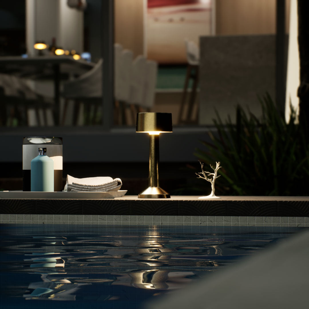 Copri | Cordless Table Lamp | Iron, Acrylic | Gold color of product | Warm light on | Mid-range distance to lamp | Near outdoor pool | Evening