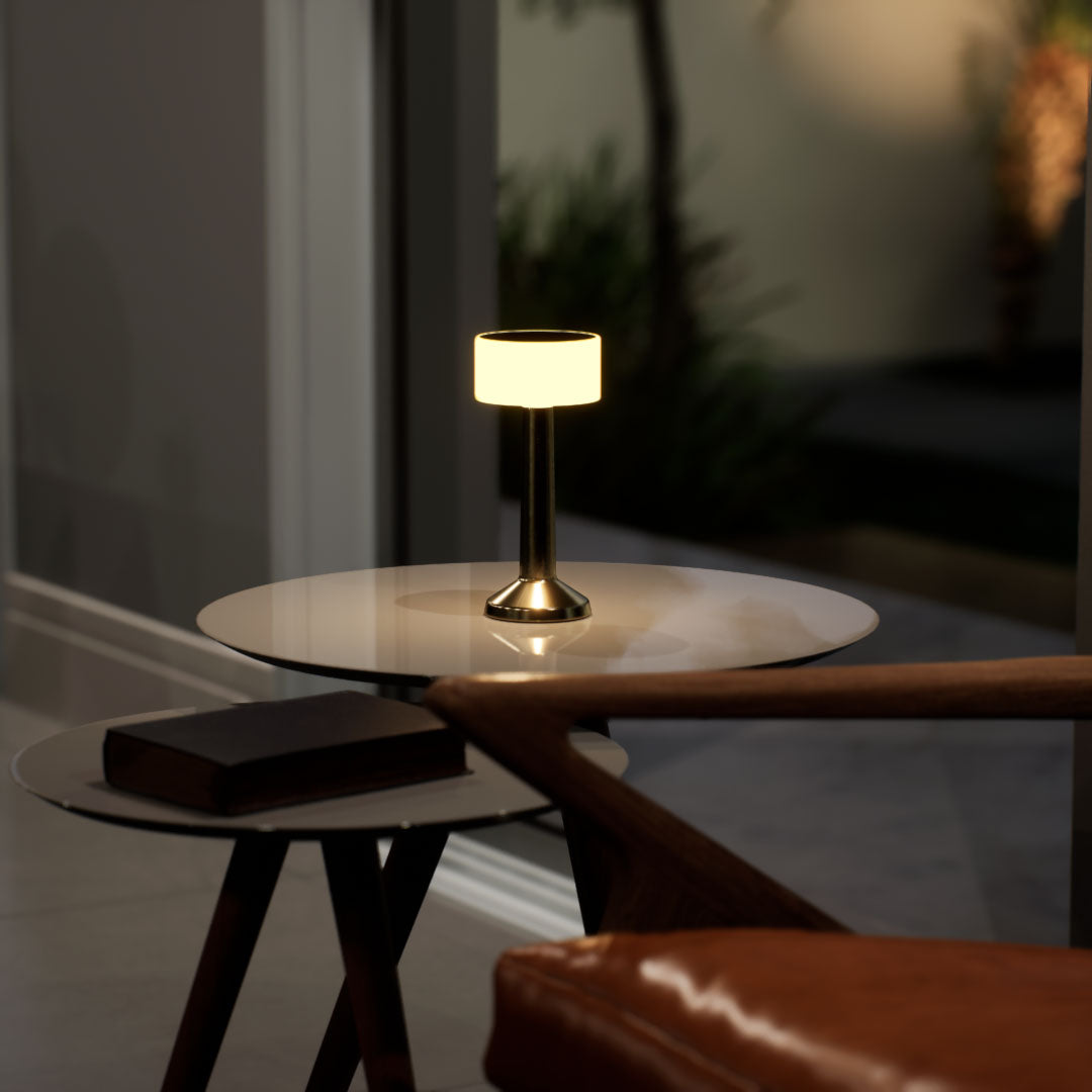Halo | Cordless Table Lamp | Iron, Acrylic | Gold color of product | Warm light on | Mid-range distance to lamp | At coffee table | Modern interior | Evening  | Scene 1