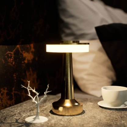 Halo Slim | Cordless Table Lamp | Iron, Acrylic | Gold color of product | Warm light on | Close-up distance to lamp | At bedside table | Modern interior | Evening