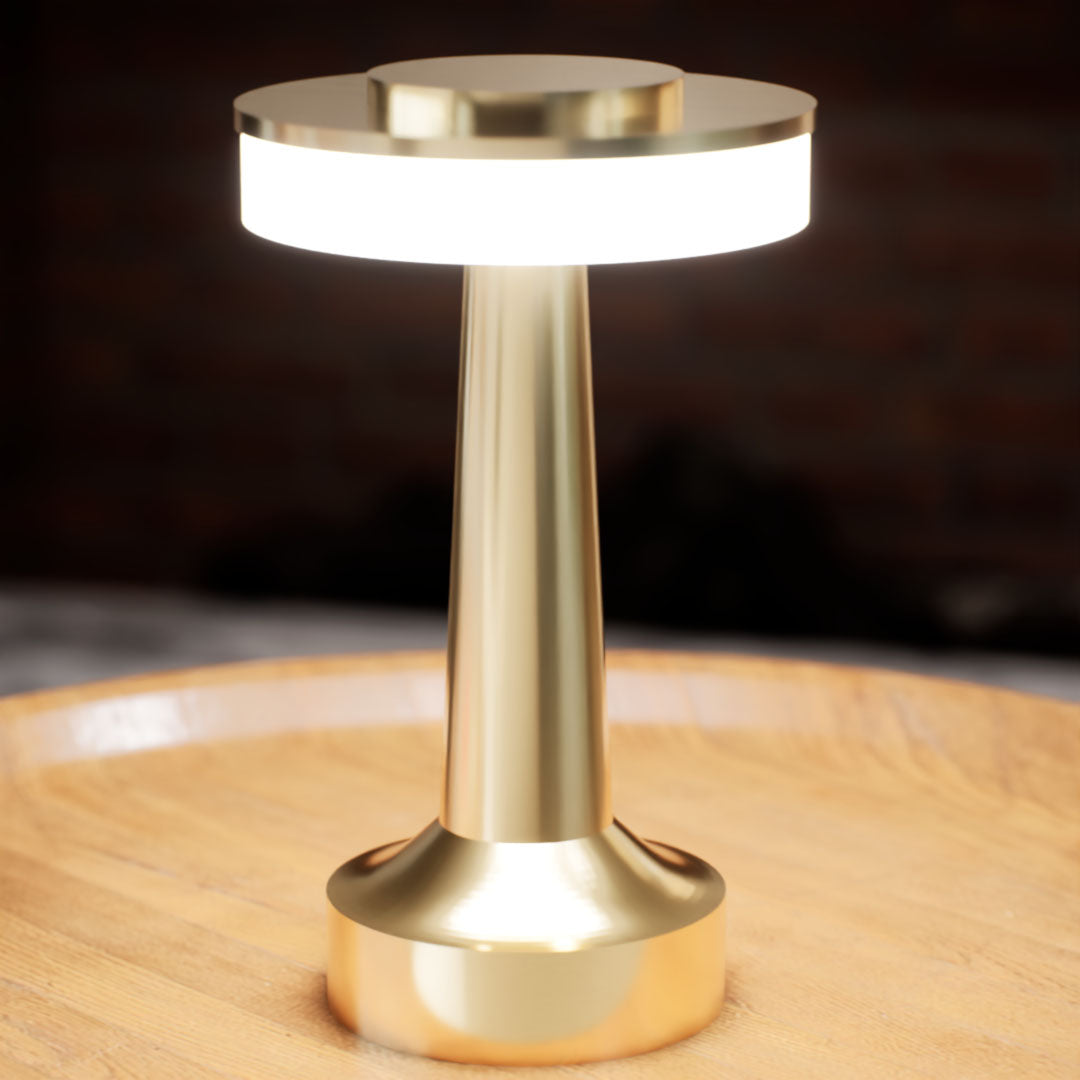 Halo Slim | Cordless Table Lamp | Iron, Acrylic | Gold color of product | White light on | Close-up distance to lamp | At coffee table | Modern interior | Evening | Scene 4