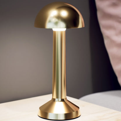 Retro | Cordless Table Lamp | Iron, Acrylic | Gold color of product | Warm light on | Close-up distance to lamp | At bedside table | Modern interior | Evening | Scene 4